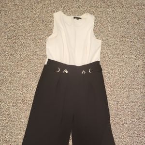 White top and black pant jumpsuit with black cloth belt spense size 6